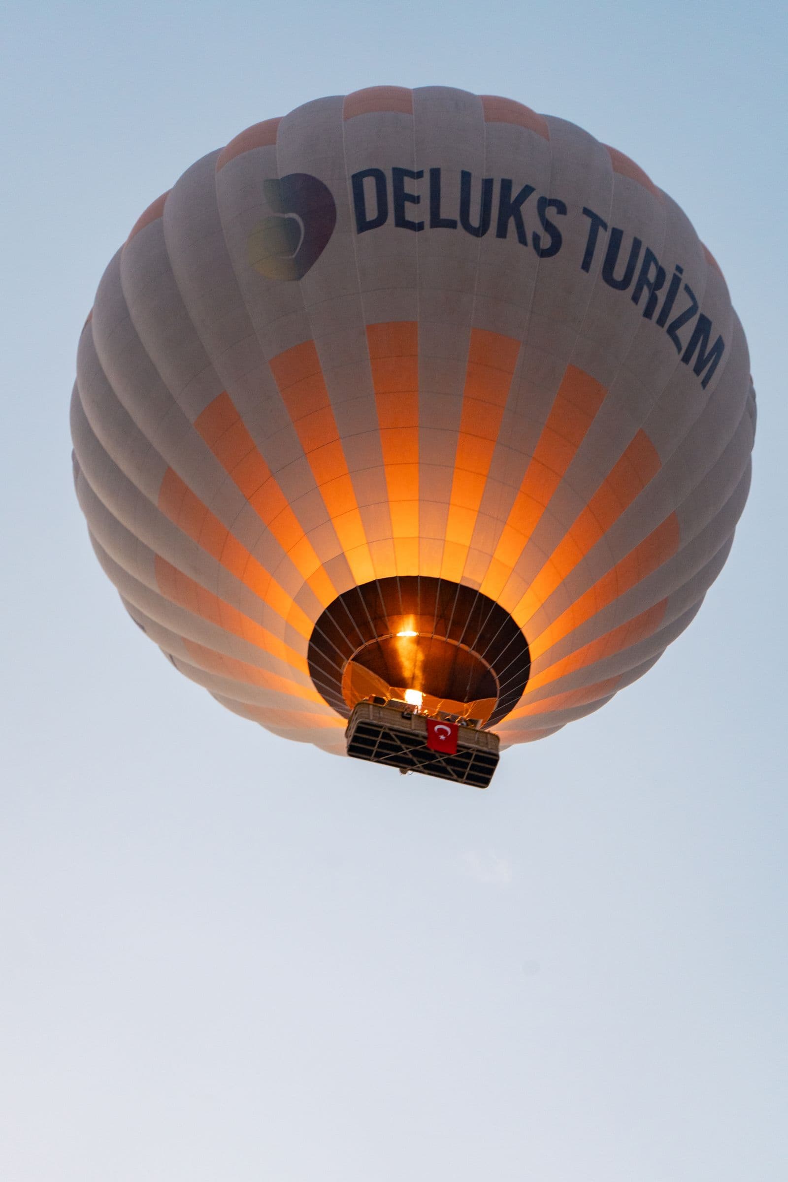 Travelers watching the sunrise from a balloon